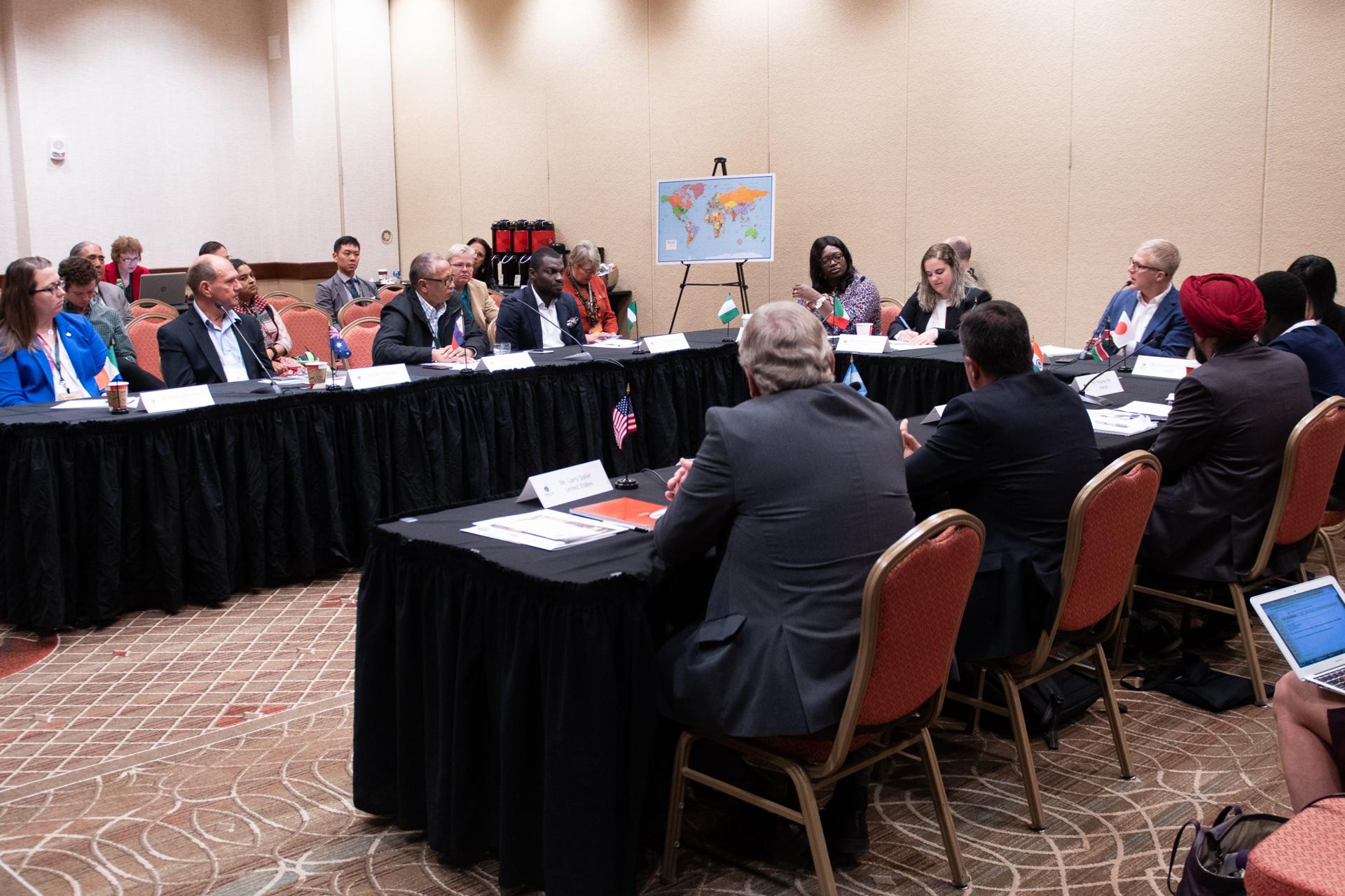 International farmers at a GFN policy roundtable with country flags